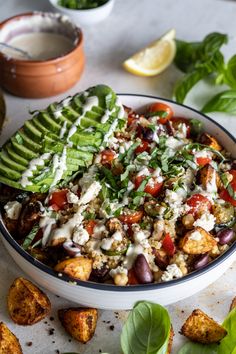 a bowl filled with vegetables and topped with dressing