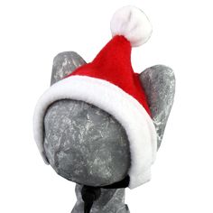 an elephant wearing a santa hat on top of it's head with snow flakes