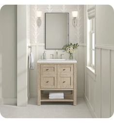 a bathroom with a sink, mirror and towel rack in it's center area