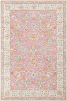 a pink and yellow rug with an ornate design