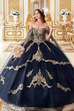 a woman in a blue and gold ball gown