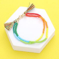 * Size : 1" H, 6.75" * Lobster Clasp Closure * Lead and Nickel Compliant Adjustable Rainbow Beaded Bracelets For Spring, Adjustable Rainbow Beaded Bracelet For Spring, Multicolor Casual Jewelry With Tassels, Spring Multicolor Friendship Bracelets With Letter Beads, Colorful Bohemian Beaded Bracelets For Spring, Bohemian Multicolor Beaded Bracelets For Spring, Beaded Bracelets With Tassels For Beach, Multicolor Beaded Bracelets For Spring, Spring Multicolor Beaded Bracelets With Round Beads