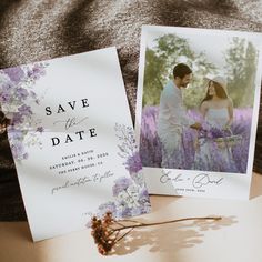 two wedding cards with the same photo on them, sitting next to each other in front of a blanket