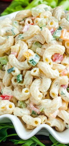 a white bowl filled with macaroni salad