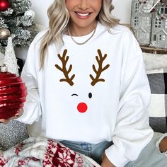 Minimal Reindeer Face Holiday graphic on front of sweatshirt. Adult Sizes S-XXL (unisex sizing)Youth Sizes S-XL (unisex sizing) Toddler Sizes 2T-4T Click here to view all Minimal Reindeer sweatshirts! Gildan 18000 Heavy Blend, Port & Co, Jerzzees (availability varies)50/50 cotton/polyesterClassic, unisex fit1x1 rib with spandex Rabbit Skins7.5 oz./yd² (US), 12.5 oz./L yd (CA), 60/40 cotton/polyesterWhite is sewn with 100% cotton threadCoverstitched collar, shoulders, armholes, ribbed cuffs and w White Sweatshirt For Fall Holiday, White Casual Sweatshirt For Holidays, Casual White Holiday Sweatshirt, Casual White Sweatshirt For Holidays, Ugly Sweater Diy, Sweatshirt Colors, Reindeer Face, Camp Style, Diy Halloween Projects