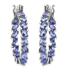 "These tanzanite hoop earrings are the perfect accessory to elevate your look for any occasion. These stunning hoop earrings for women feature sparkling tanzanite gemstones set in a unique \"inside out\" design, allowing the gems to be visible from every angle. The tanzanite stones are expertly crafted in a Marquise-cut design, adding a dazzling shimmer to your style. Item Details- Metal- Sterling Silver Stone- Natural AAAA Tanzanite Shape- Marquise 5x2.5mm Total Weight- 5.50 Ct Approx Finish- Silver Setting- Prong" Tanzanite Marquise Earrings, Spiritual Beauty, 1960s Jewelry, Hoops Silver, Tanzanite Jewelry, Tanzanite Earrings, Tanzanite Stone, Tanzanite Gemstone, Marquise Cut