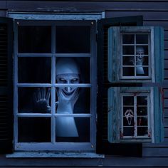 an image of a creepy person looking out the window at another scary character in it