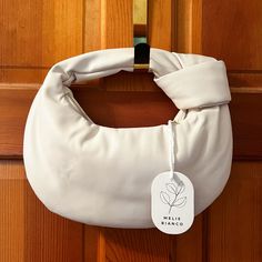 The Alexandra Was Made In Collaboration With Fabfitfun. Designed In A Pillowy And Soft Silhouette, This Top Handle Bag Is Made With Vegan Leather And Features An Interior Zip Pocket. Vegan Leather 12"L 6.375"H Handle Drop: 3.5" Zipper Closure Gold-Tone Hardware Interior Zip & Slot Pocket White Crossbody Baguette Bag For Shopping, White Baguette Crossbody Bag For Shopping, Trendy White Hobo Bag For Shopping, Chic White Rectangular Hobo Bag, White Hobo Shoulder Bag With Removable Pouch, White Baguette Bag With Removable Pouch For Errands, White Pouch Hobo Bag For Shopping, White Hobo Pouch Bag For Errands, White Pouch Hobo Bag For Errands