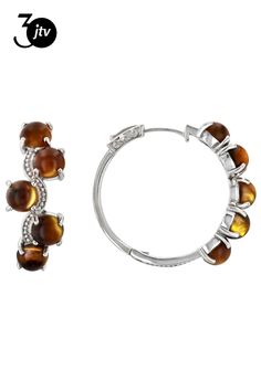 6mm Round Cabochon Tigers Eye Rhodium Over Sterling Silver Hoop Earrings. Measures Approximately 1.17"L x 0.47"W. Hinge with Noted post. Sterling Silver Round Clip-on Jewelry, Round Hinged Huggie Earrings For Anniversary, Nickel-free Hoop Jewelry For Anniversary, White Gold Round Huggie Earrings, Formal Nickel Free Hoop Jewelry, Pierced Round Hoop Earrings In White Gold, Pierced Round White Gold Hoop Earrings, Round Metal Cabochon Earrings, Metal Clip-on Round Jewelry