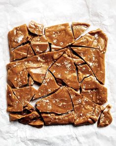 pieces of peanut butter crackers on top of white paper with brown sugar sprinkles