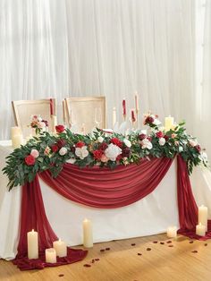 a table with candles and flowers on it