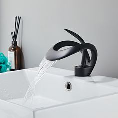 a faucet with water running from it's spout in a bathroom