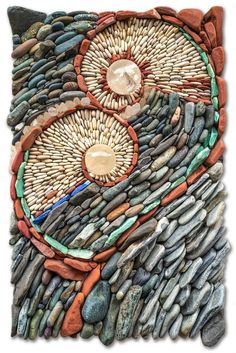 a piece of art made out of rocks and stones