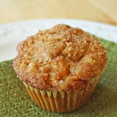 a muffin sitting on top of a green place mat