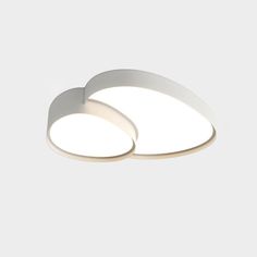 two white circular lights on a gray background