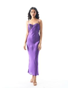 Modal satin slip dress with ruched top detailWear her out a few nights and you’ll soon realise that the Bella Donna Dress is a beauty you can count on. The satin slip dress features an alluring ruched neckline, and comes in an enlivening, vivid, violet hue. Tailored to a slim-fit silhouette with a side-zipper closure to keep you snug.Product details: Material/Fabric - Modal Satin Fit- Slim fit Closure - Side zipper Size chart: SIZE 6 8 10 12 14 16 18 20 (XXS) (XS) (S) (M) (L) (XL) (XXL) (XXXL) B