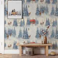 the wallpaper is decorated with deer and pine trees in blue, white and red