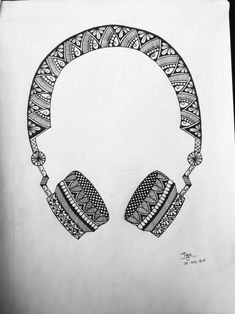 a drawing of headphones on top of a piece of paper with an intricate design