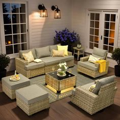 a living room filled with lots of furniture and decor on top of a hard wood floor