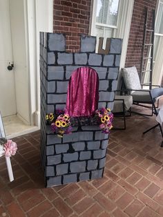 a castle made out of cinder blocks and flowers