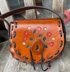 This is a adorable sweet but small tooled and painted leather hippie boho bag....big enough for an adult who just needs a smaller bag for a special event... this bag is from the 70s but was never used...it has been in my storage since the 70s....we used to have a leather boutique and this is a left over inventory....I made that bag in the 70s....the leather is good. the quality of the bag is good.... measurements are 5 1/2 inches tall, 6 1/2 inches across, the gusset is 2 inches wide and the sho 70s Bags, Festival Bag, Painting Leather, Purse Accessories, Boho Bag, Boho Festival, The 70s, Lovely Things, 70s Fashion