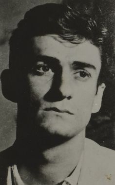 an old black and white photo of a man