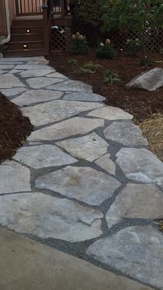 a stone path leading to a house