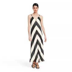 *Limited Time Listing* Classic Style Gets A Bold, Modern Twist With A Lightweight, Flowy Fabric That Skims The Figure In A Slinky Slip Dress Fashioned With Slender Straps That Lead To Long Ties Flowing At The Back For Lovely Movement. Black And White Chevron Stripes Add A Touch Of Artistic Flair, While A High Center Slit Lends Alluring Style. Finishing Off The Piece Is A Sharp V-Cut Front And Back For A Dress That's Equal Parts Chic And Elaborate. Polyester Blend. Christopher John Rogers, Long Sleeve Ruffle Dress, Blue Floral Maxi Dress, Target Dress, Chevron Dress, Rainbow Dress, Check Dress, Striped Maxi Dresses, Tiered Maxi Dress