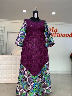 Sparkly Guipure lace with laser cut designs V neckline front and back A line long sleeves 64" length Mannequin is 5 10" wearing size 16 US Product is true to color Made in Nigeria Available sizes 10-22 US Nigeria Lace Styles Woman Dresses, Style For Lace Gown Long, Lace Dress Design Nigeria, A Line Gown Styles, A Line Ankara Gown Styles, A Line Gown Ankara, Ankara Lace Dress Styles