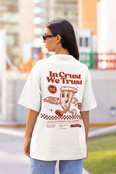 Retro Pizza Tshirt, Pizza Shirt, 90s Nostalgia Shirt with a 2 Part Design on the Front and Back, with a Quote that Reads: In Crust We Trust. Order a size or two up for an oversized look. We Offer Free UK and US Delivery. NOTE TO OUR CUSTOMERS We are a new business and very much appreciate your support! If you love your Tee as much as we hope you do, please leave us a review, thank you in advance- stay cosy and stay groovy! 💚 HOW TO ORDER 💚 1. Check our photos for sizing and colour options. 📏 Food Tshirt Design, 90s Tshirt Design, Retro Tshirt Design, Retro Pizza, Foodie Outfit, Stay Groovy, New York Shirt, Pizza Tshirt, Pizza Shirt