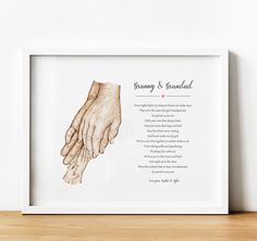 a framed print with an image of two hands holding each other's hand and the words family and grandad written on it