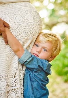 a little boy is hugging his mother's back with the caption that reads, new born baby wishes and congratulations messages