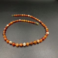 The orange color carnelian beads from my collections of ancient beads. The origin of this beads from India although the carnelian agate can be found in Pakistan Nepal and Afghanistan as well There is much or less white patina on almost every beads which shows this agate was undergrounded for many years small agate beads used as counter beads best gift for the people who collect ancient beads and best for the people who study ancient history we provide fast and free shipping to our customers by w Carnelian Single Strand Necklace For Healing, Single Strand Carnelian Necklace In Amber, Single Strand Carnelian Necklace For Healing, Amber Carnelian Single Strand Necklace, Amber Carnelian Necklace With Polished Beads, Orange Carnelian Hand-strung Necklace, Hand-strung Orange Carnelian Necklaces, Amber Carnelian Hand-strung Necklace, Orange Single Strand Spiritual Necklace