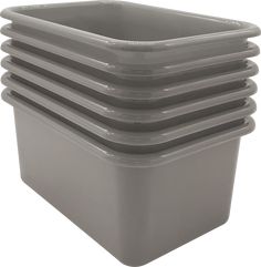 a stack of grey plastic containers sitting on top of each other in front of a white background