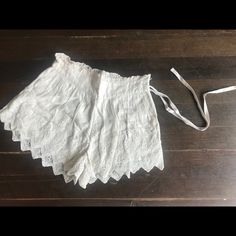 Free People High Waisted Lace Shorts With Ruffles And Waist Tie. Never Worn, Perfect Condition. Cream Color. Very Feminine And Fun. Fitted Summer Bottoms For Daywear, Daywear Bloomers With Elastic Waistband, Vintage Bottoms With Lace Trim For Summer, Vintage White Beach Bottoms, Vintage Lace Trim Bottoms For Summer, Fitted Short Summer Bloomers, Fitted Short Bloomers For Summer, Summer Daywear Shorts With Lace Trim, Summer Daywear Bloomers With Elastic Waistband