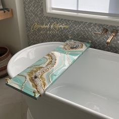 a white bath tub sitting next to a window