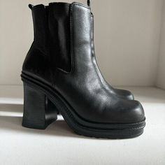 Introducing these vintage black leather booties with a stylish square toe and a super chunky block heel. These ankle boots are perfect for any fashion-forward woman who wants to make a statement.  The upper and lining material is made of high-quality leather, while the outsole is made of durable rubber. These boots come in US shoe size 10 and are perfect for any occasion.  The shoe shaft style is ankle, making them perfect for pairing with skinny jeans or dresses. With a timeless style and high-quality materials, these booties are sure to become a staple in any wardrobe. Good condition. Some wear as pictured. Made in Brazil Chunky Leather Ankle Heeled Boots, Edgy Platform Boots With Stacked Block Heel, Chunky Platform Heeled Boots With Square Toe, Edgy Chunky Platform Heeled Boots With Block Heel, Chic Chunky Leather Boots, Vintage Black Chelsea Boots With Round Toe, Vintage Black Leather Chelsea Boots, Edgy Platform Heeled Boots With Square Toe, Edgy Chunky Platform Boots With Square Toe