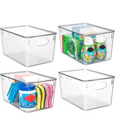 three clear storage bins with lids and handles on each side, one containing cleaning products