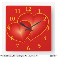 a red square clock with two hearts on it's face and numbers in the middle