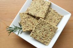 crackers on a plate with rosemary sprigs