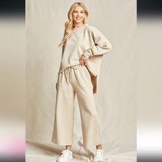 This Brand New Set Includes A Cream Long Sleeve Top With Matching Wide Leg (Functional) Drawstring Pants. There Is A Really Neat Textured Pattern Of Lines Throughout The Top And Pants. Wear This Set To Lounge Around In, Sleep In, Shop In, Or For Dropping Your Kids Off To School. Top Fits Oversized. Pants Are True To Size. (Only Tried On For The Picture) Smoke Free Home. Offers Welcome. Oversized Beige Bottoms For Fall, Comfortable Beige Pants For Lounging, Oversized Beige Pants For Spring, Relaxed Beige Bottoms For Loungewear, Beige Straight Lounge Pants, Beige Casual Wide Leg Loungewear Pants, Beige Casual Wide Leg Pants For Loungewear, Casual Beige Wide Leg Loungewear Pants, Casual Beige Wide Leg Pants For Loungewear