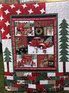 a quilted christmas tree and firetruck is on display