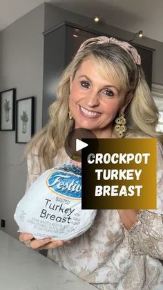 a woman holding a turkey in her hands with the words crockpot turkey breast on it