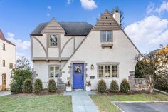 a white house with blue door and windows