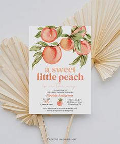 a peach themed baby shower is shown with fan fans