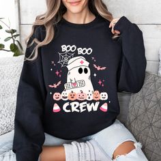 Boo Boo Crew Sweatshirt, Nurse Halloween Hoodie, Retro Halloween Nurse, Spooky Nurse, Ghost Nurse Halloween Sweatshirt, Boo Nurse Sweater This custom crewneck sweatshirt brings both incredible quality and amazing style to the mix. Made with soft, ring-spun cotton fabric with 100% cotton threads, it sits unmatched when it comes to softness. All sweatshirts feature a rolled forward shoulder and are printed with OEKO-TEX-certified low-impact dyes. Lastly, Comfort Colors is a proud member of the US Cotton Trust Protocol which means sustainable cotton sourcing that's good for the environment.  .: 100% ring-spun cotton .: Light fabric (6.4 oz/yd² (217 g/m .: Relaxed fit .: Sewn-in twill label Nurse Sweater, Nurse Crewneck, Boo Boo Crew, Custom Crewneck Sweatshirts, Nurse Halloween, Boo Crew, Comfort Colors Sweatshirt, Halloween Nurse, Halloween Hoodie