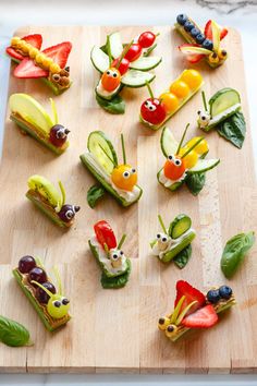 the food is made to look like bugs and vegetables are on a cutting board, ready to be eaten