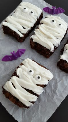 some brownies with white frosting and eyes on them