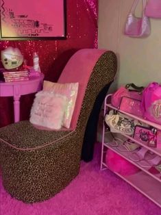 a pink and leopard print chair next to a shelf with shoes on it in a girls'bedroom