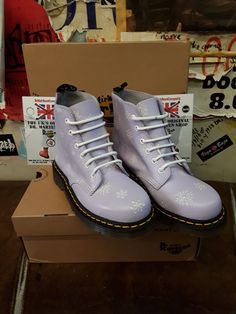 These 6 hole boots are definitely a rare colour combination.  They are a Dr Martens boot finished in a Lilac leather with a snowflake background.  They are very cute and in short supply. They have trademark cushioned sole unit and yellow stitching.  We have various sizes, please check the listing. Snowflake Background, Colour Combination, Dr. Martens Boots, Dr. Martens, Boot Shoes Women, Color Combinations, Combat Boots, Womens Boots, Lilac